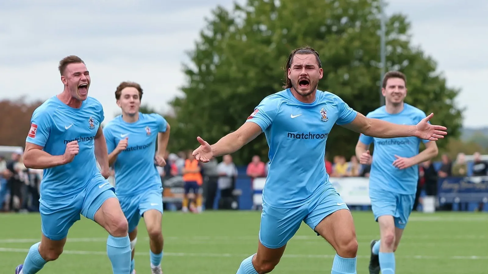 Brentwood Town players celebrating a goal at The Arena, in the picture the Isthmian League used for its FA Cup round-up